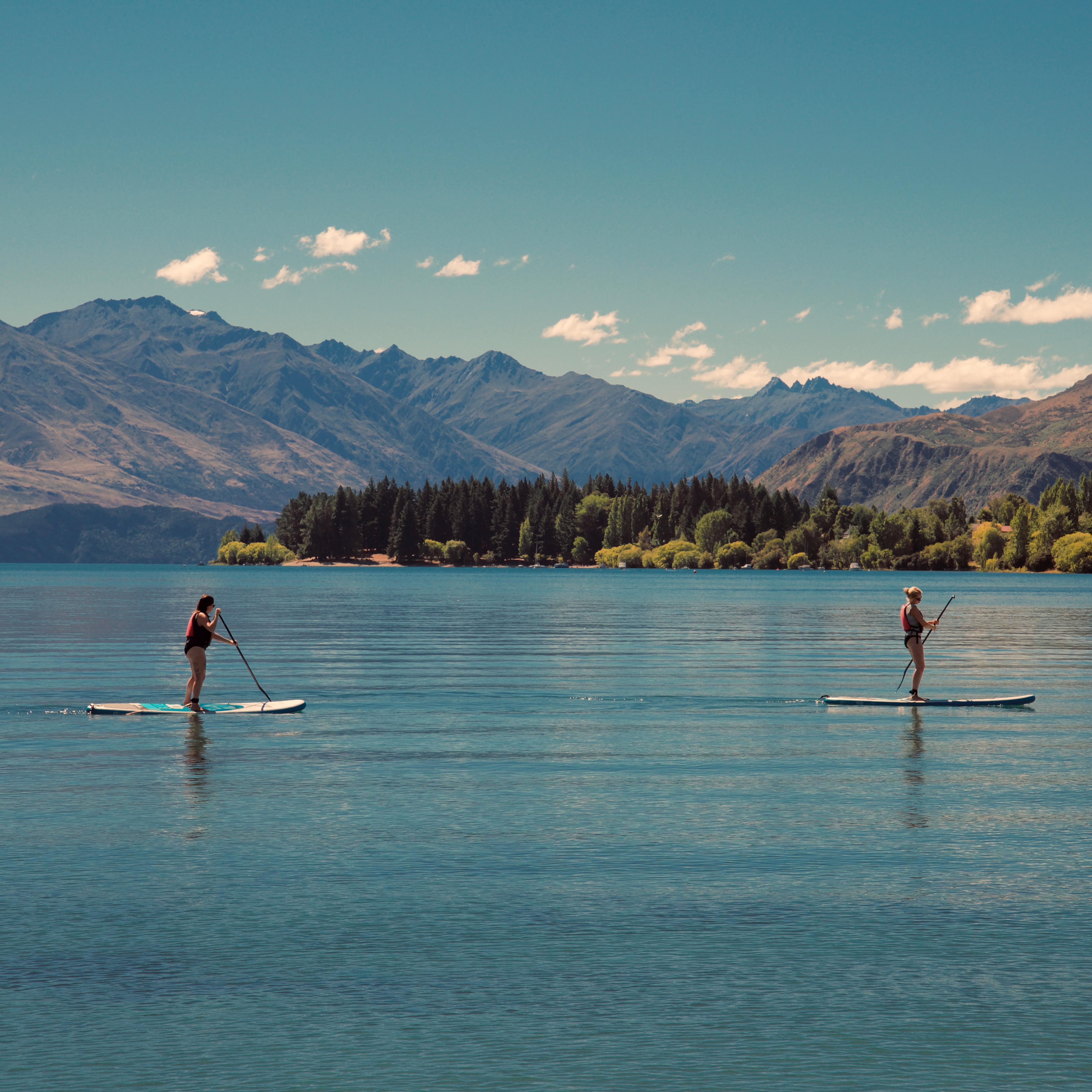 Two people paddle boarding on Lake Wanaka