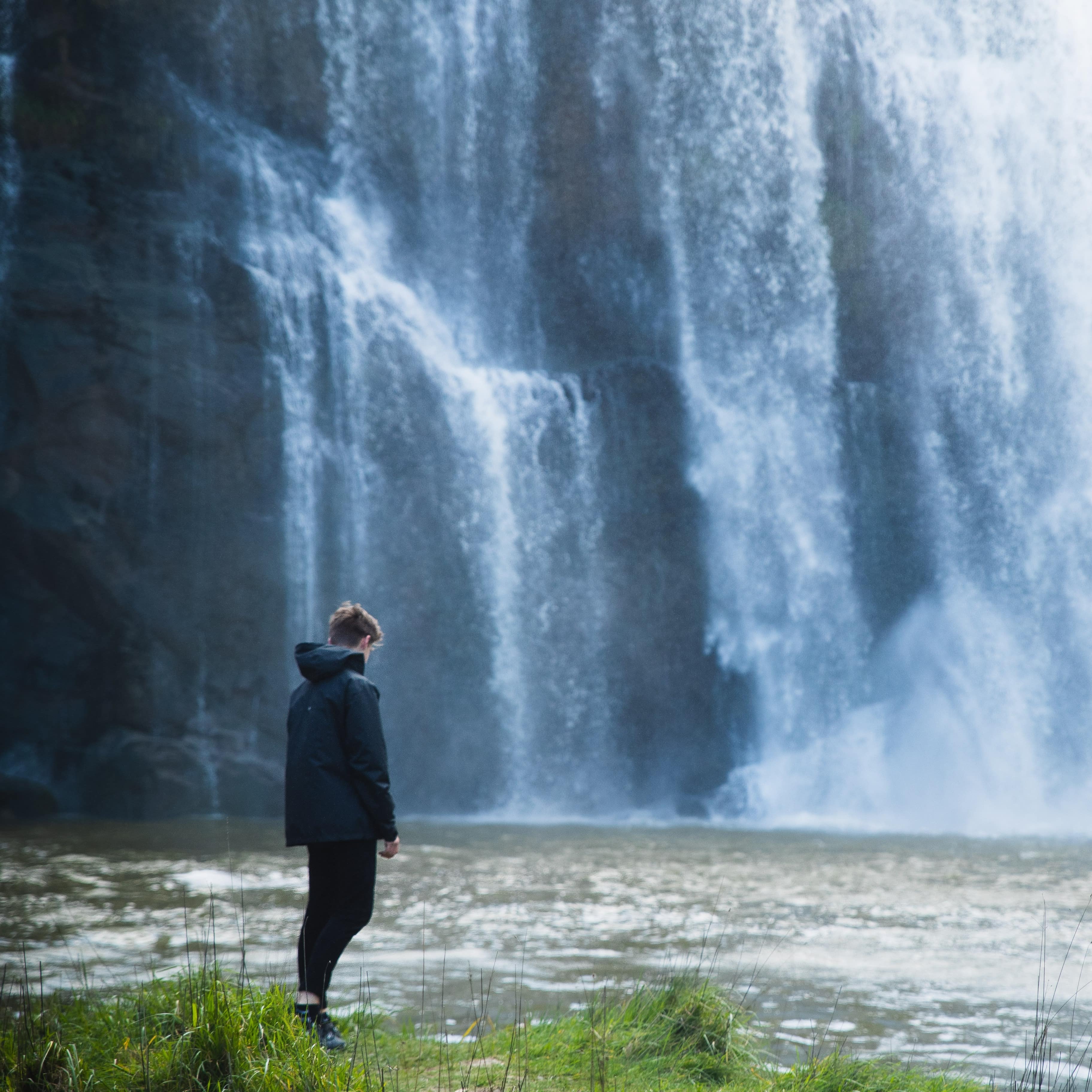 Person looking at a waterfall