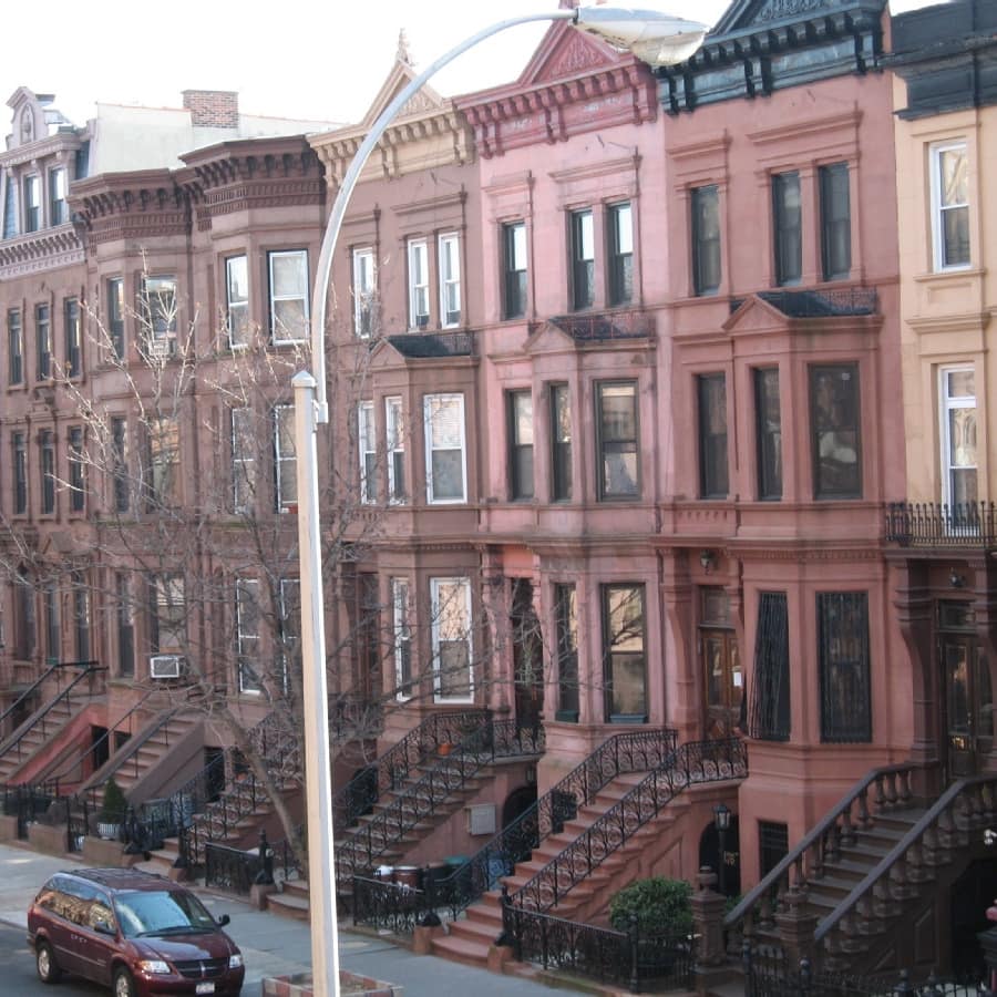 Three-storey multi-coloured townhouses of historic Brooklyn Brownstone neighbourhood